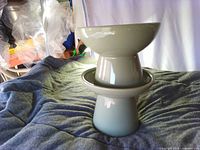 Both ceramic dip bowls stacked to show bowl and base