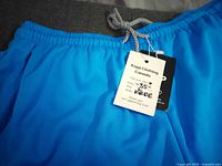 Tag on waistband showing brand Keep Clothing Canada and size info