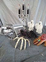 Entire lot showing candelabra, ghosts, spiders, hands, packaged decorations
