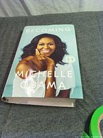 Front cover of Becoming hardcover showing scuffed dust jacket