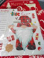 Sticker sheet on red fabric background