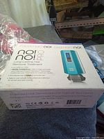 Closed box showing brand, model, and product information