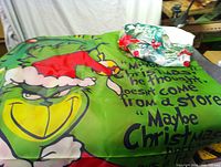 Overall view of Grinch wall hanging and folded holly runner