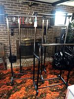 Front view of three metal clothing racks
