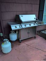 Full view of grill with both propane tanks