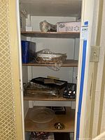 Full cabinet view showing majority of items on shelves