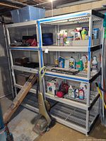 Overall view of two shelving units set against basement wall