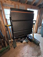 Full view of upright salt spreader showing hopper and spinner