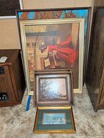 Stacked view showing largest piano scene print, two landscape pieces and city scene print