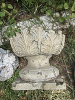 Top and side view of weathered resin acanthus urn planter showing overall design, patina, chips and cracks
