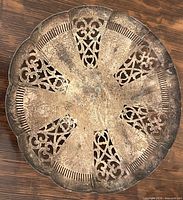 Top view showing pierced filigree pattern and scalloped rim