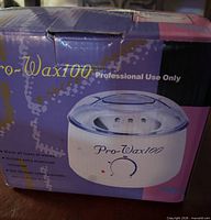 Retail box showing Pro-Wax100 branding and product image