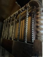 Close view of spool-turned spindles on headboard/footboard