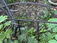 Close-up of upper section showing bird and flower motifs, scrollwork, finish and condition