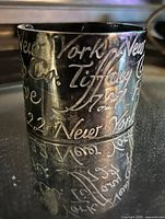 Front view showing full width and cursive script engraving