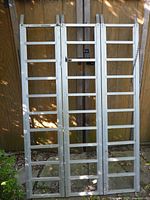 Front view of tri-panel aluminum ramp standing upright