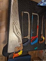 Group shot of large hand saw, two hack saws, keyhole saw