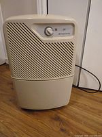 Front view of beige Simplicity 28 humidifier with dial