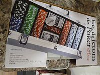 Front of boxed 300-pc poker chip set showing chips and aluminium case