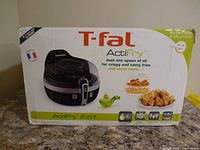 Retail box showing T-fal ActiFry 2 in 1 imagery and branding