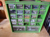 Front view of green organizer showing drawers and contents