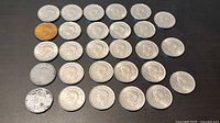 All 28 coins laid out obverse up