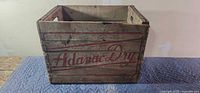 Front view showing red Adanac Dry script on slat crate