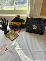 All three vintage handbags grouped together