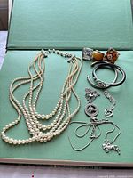 Assorted jewellery laid out showing all items