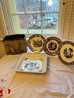 Group shot of planter, square dish, and three plates