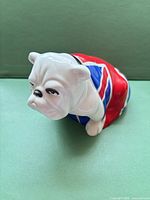 Front angled view of bulldog figurine showing Union Jack flag and facial details