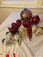 All 20 ornaments displayed on cloth