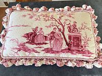 Front view showing entire Aubusson needlepoint pillow with tassel fringe