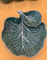 Top view of cabbage-leaf platter with attached dip dish
