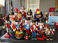 Wide shot of all nutcrackers grouped on table