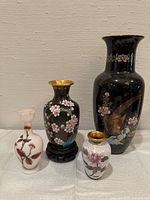 All four cloisonné vases grouped
