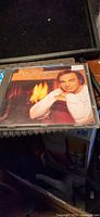 Front cover showing Neil Diamond by fireplace