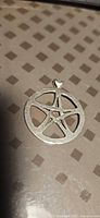 Front view of sterling silver pentacle pendant
