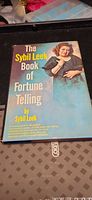 Front cover of The Sybil Leek Book of Fortune Telling hardcover with dust jacket