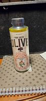 Front view of sealed Korres Pure Greek Olive Verbena Blossom shower gel bottle