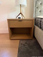 single bedside table showing drawer front and open shelf