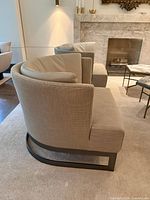 Side view of Cervino chair showing profile, armrests, cushion, and sled base