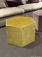Front angled view of green hexagon ottoman