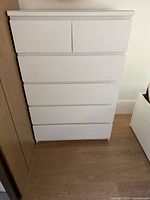 Front view of white 6-drawer Malm dresser