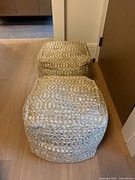 Both woven poufs side view showing pattern and shape
