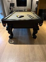 Full view of Olhausen St. George pool table with cues and balls