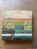 Front view of square mixed media artwork showing full composition