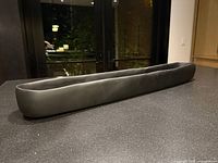 Side view showing length and matte black finish