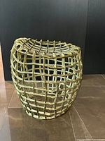 Front angled view showing woven aluminum grid structure