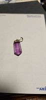 Front view of hexagonal amethyst pendant with bail